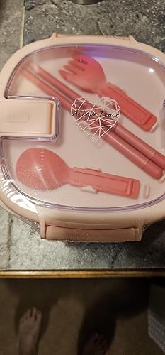 Close-up of the included utensils and chopstick storage