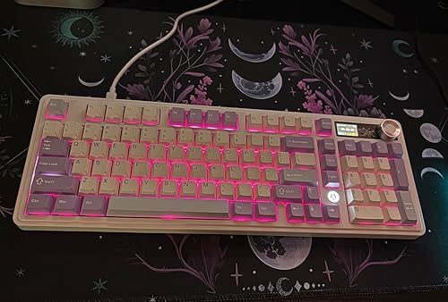 AJAZZ AK980 purple mechanical keyboard with RGB lighting on a desk setup