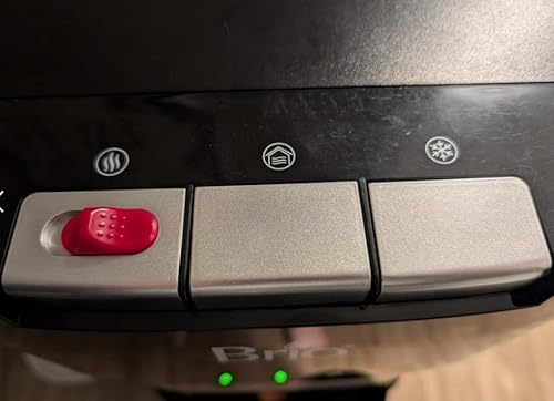 Customer photo showing the Brio dispenser cabinet open with water bottle