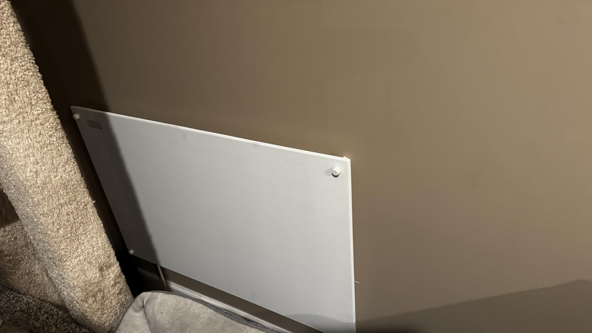 Customer photo showing the EconoHome heater installed on a wall