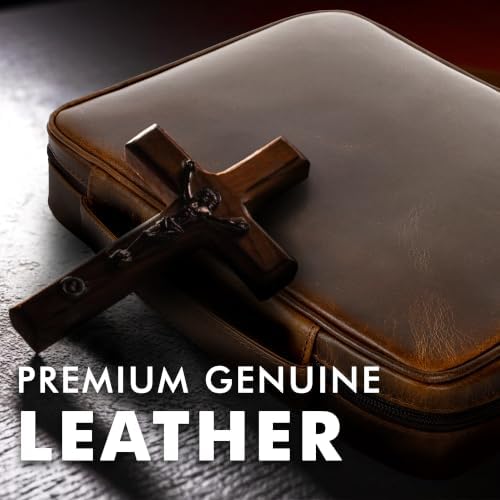 Close-up of the ELIZO Bible cover's full-grain leather texture with the included wooden cross resting on top