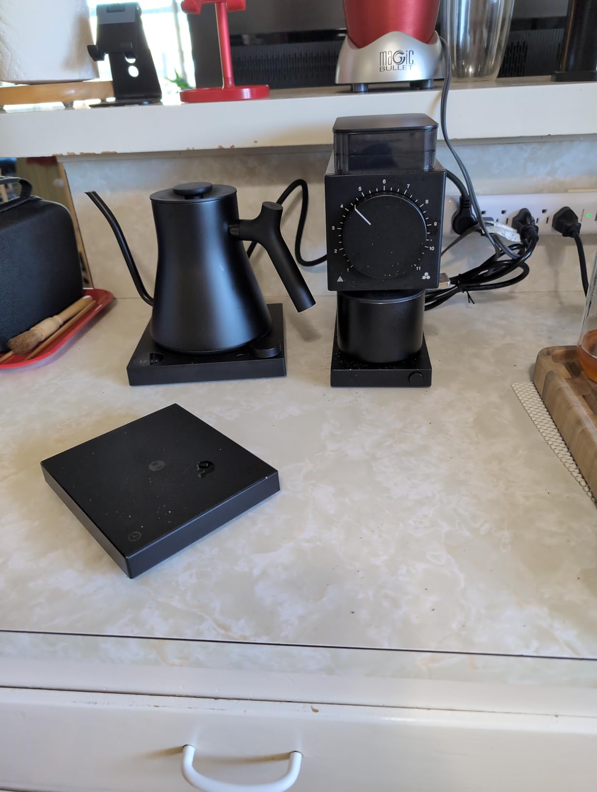 Fellow Ode Gen 2 grinder with ground coffee in catch cup