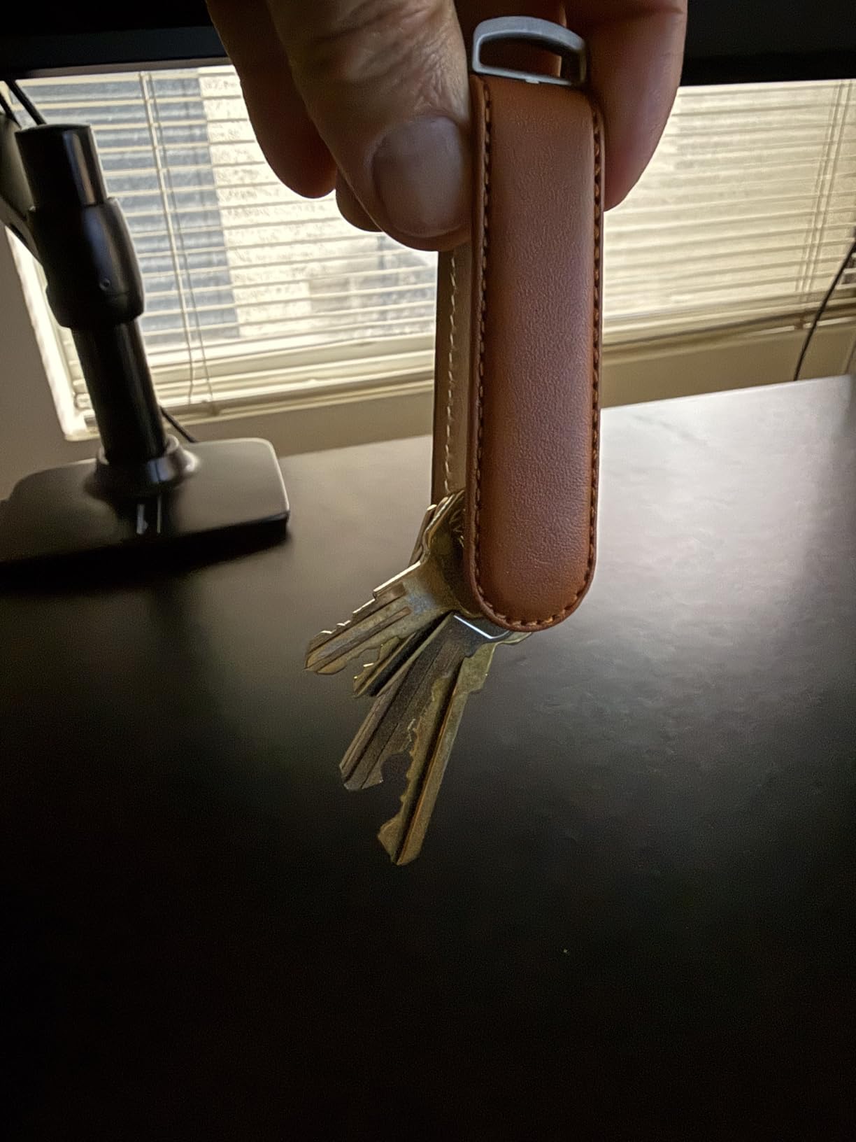 Jibbon key organizer in pocket showing compact profile