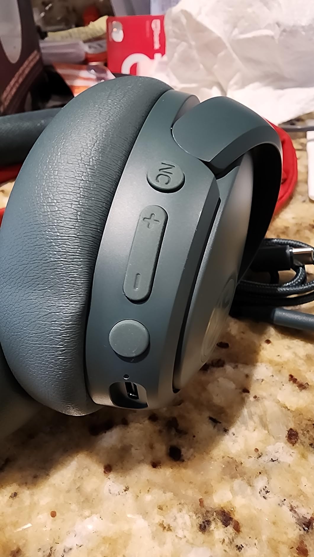 Customer photo showing JLab JBuds Lux ANC headphones in daily use