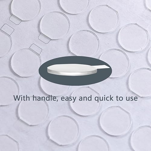 Close-up of an LMJIA mounting dot with its pull-tab handle on the backing sheet