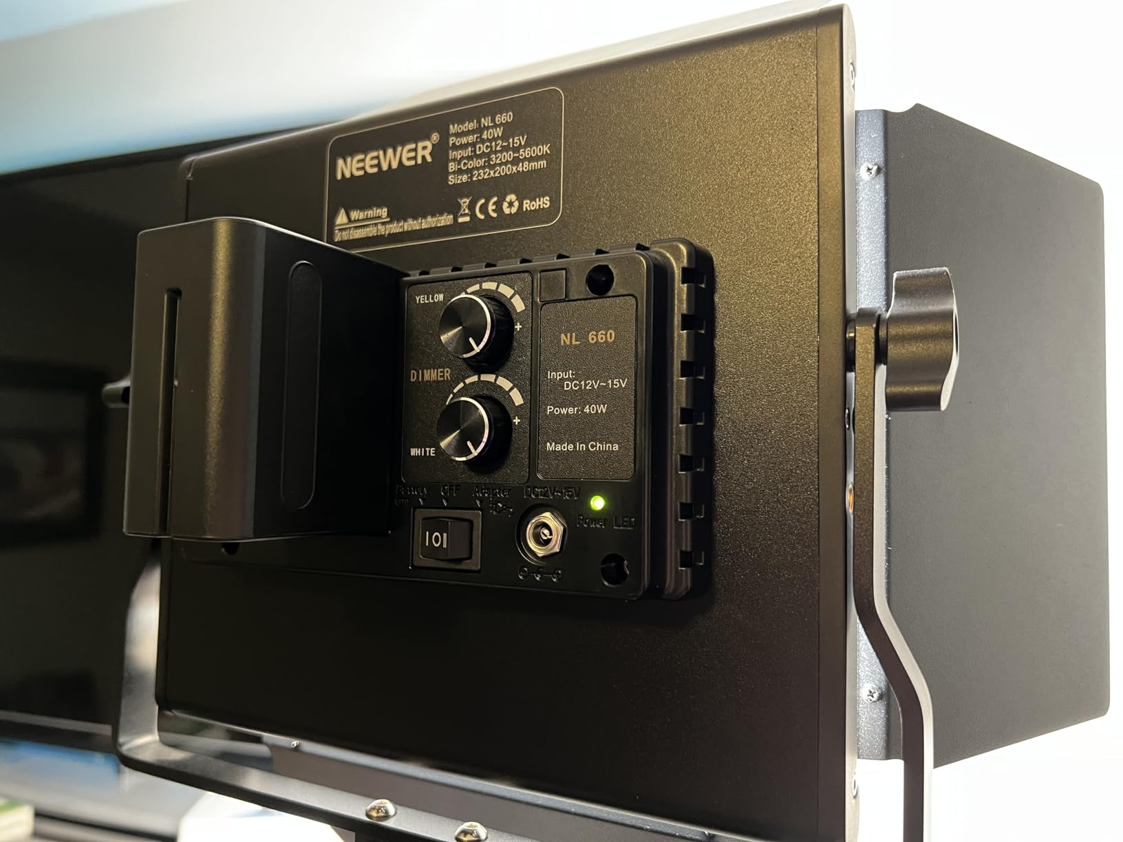 Customer photo showing Neewer batteries powering LED video light