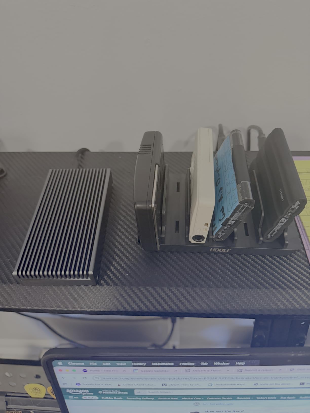 Customer photo showing UDOLI dock stand with multiple devices